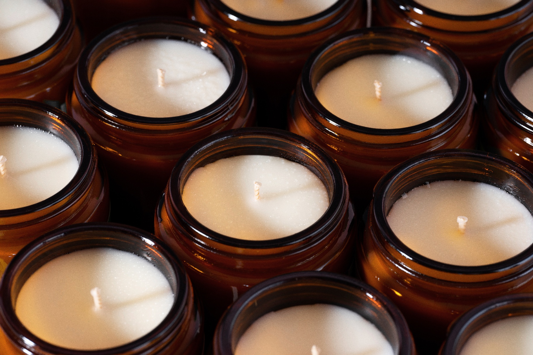 Amber glass candle with warm flame